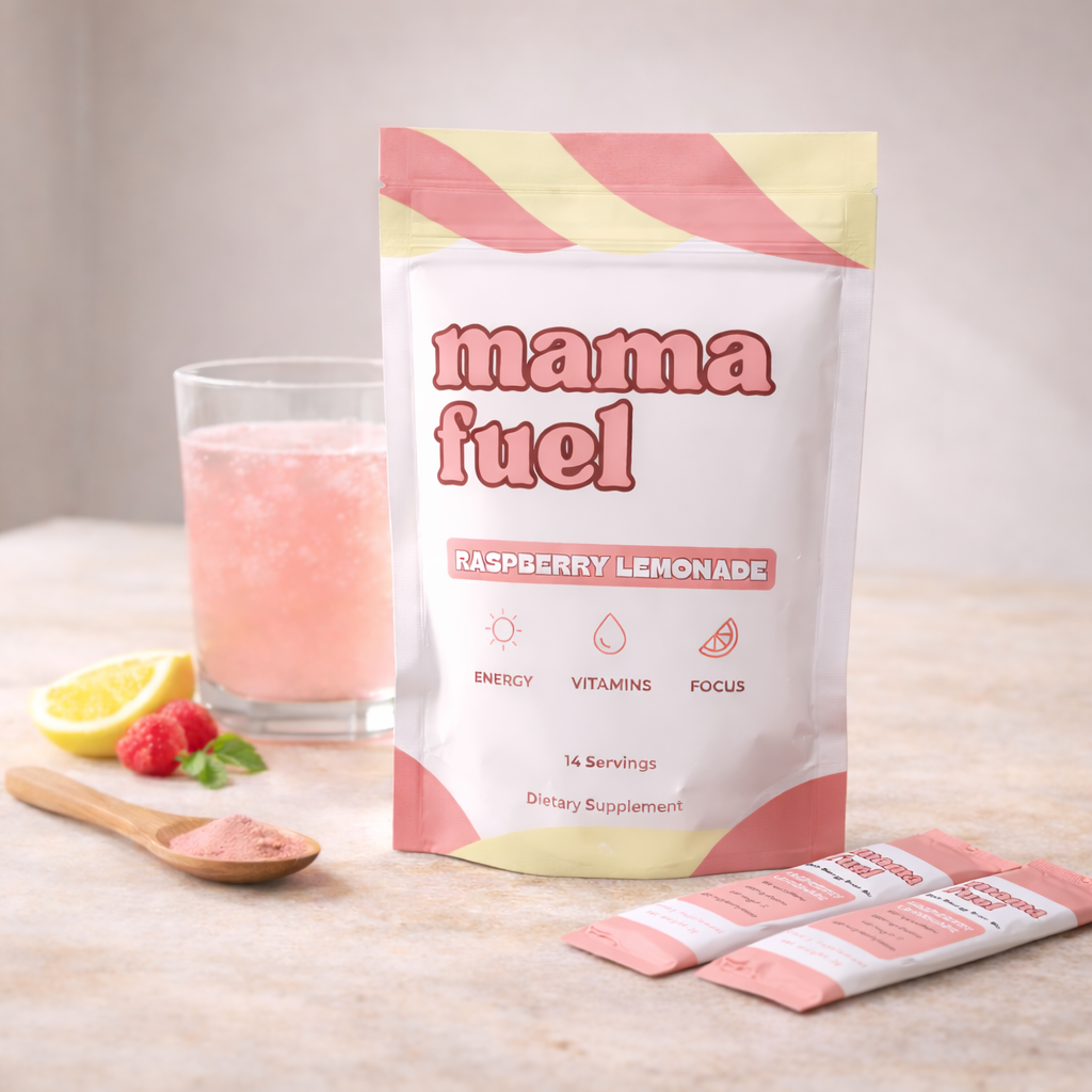 Mama Fuel raspberry lemonade supplement package with a glass of pink drink and lemon slices on a wooden surface.